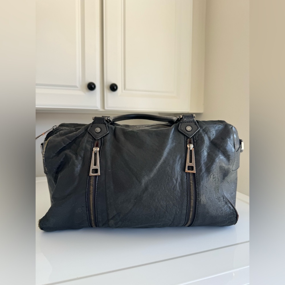 Vintage-effect patent leather bag